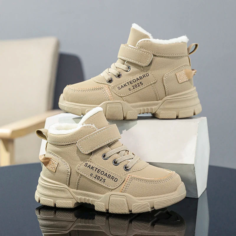 A pair of children's winter velvet warm snow boots with leather waterproof and anti-slip wear-resistant high-top cotton shoes