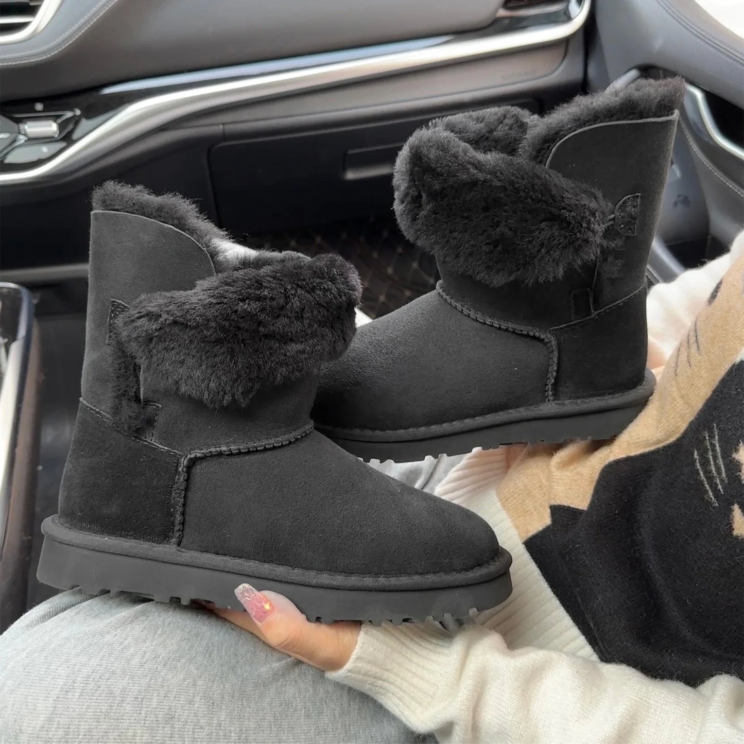 A pair of pure sheepskin and wool winter snow boots for women, warm and comfortable. Simple and fashionable women's shoes