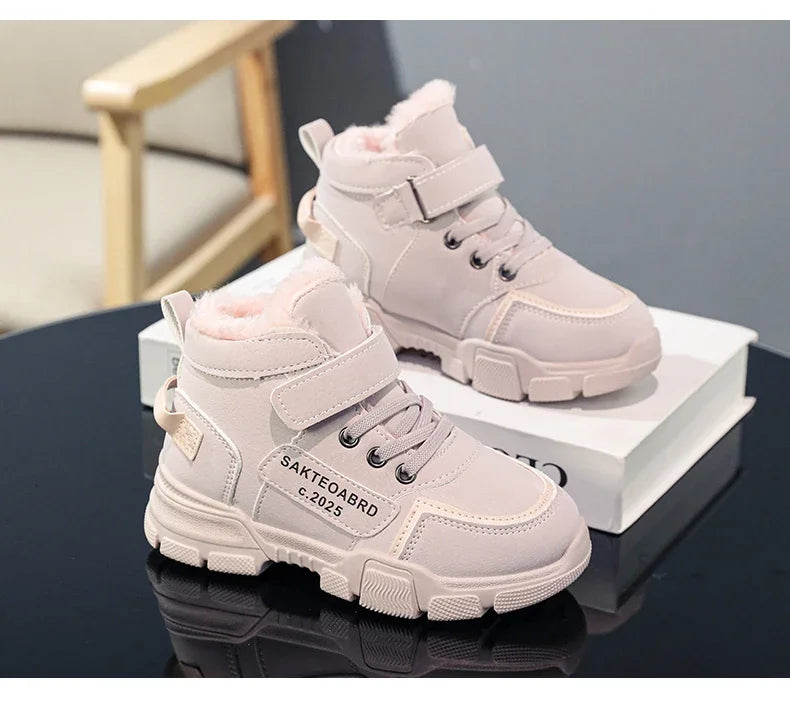 A pair of children's winter velvet warm snow boots with leather waterproof and anti-slip wear-resistant high-top cotton shoes