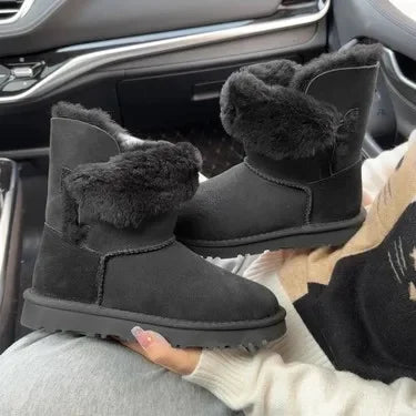 A pair of pure sheepskin and wool winter snow boots for women, warm and comfortable. Simple and fashionable women's shoes